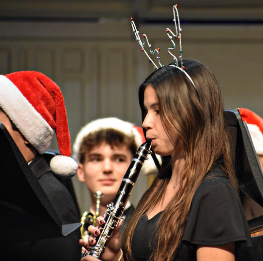 Senior Sophia Spinelli dons reindeer antlers for the performance.